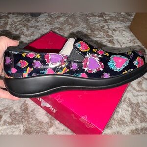 Alegria Black Slip-On Sneakers with Heart Design